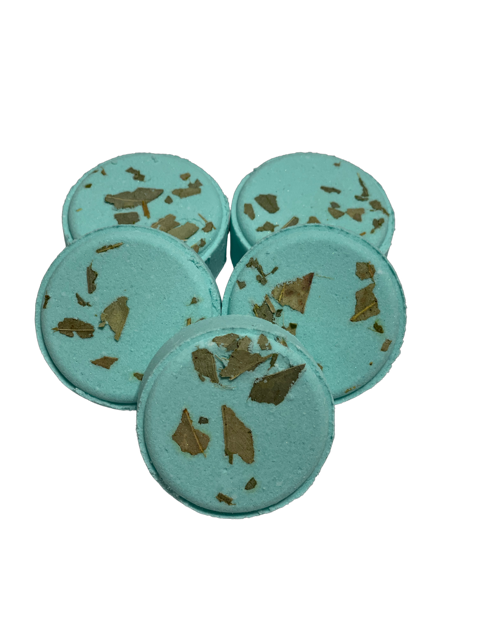 A set of blue shower steamers with eucalyptus leaves embedded in them.
